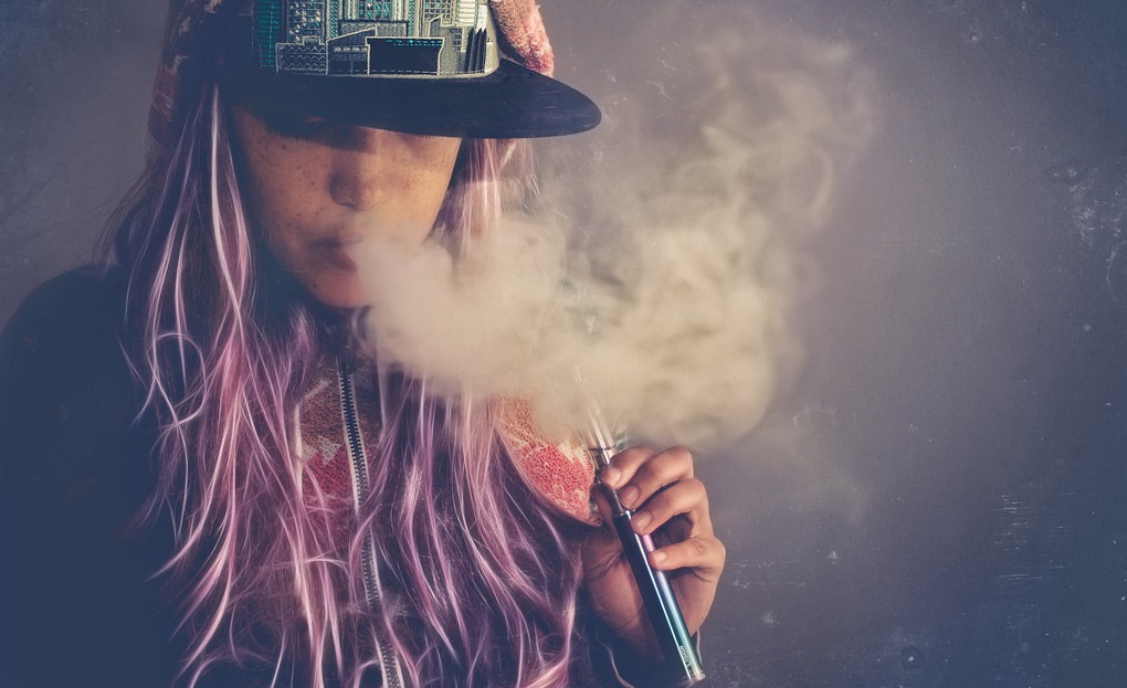 girl smoking a ego vape pen mod